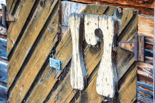 The number 17 is carved into a wooden door
