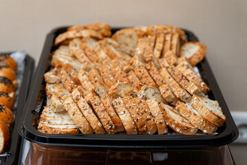 Sliced multigrain bread on tray