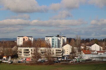 Urban Landscape with Colorful Buildings and Clouds