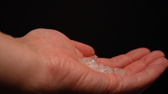 Methamphetamine drug in rocks. Crystal meth or methamphetamine a recreational and highly potent and addictive drug. Crack cocaine in hard form of crystals. Addiction and drug trafficking.