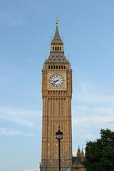 Big Ben stands tall against the clear London sky showcasing its iconic clock and historic architecture in the heart of the city