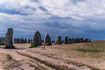 Ale's Stones, a prominent megalithic ship setting, standing majestically on a windswept field under...