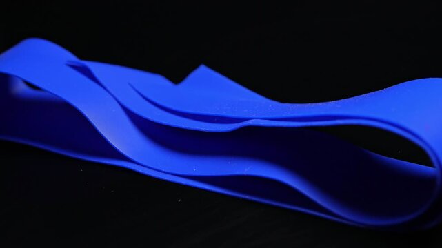 Tourniquet used for identifying a vein for injection entry. Tourniquet or tie is a long strip of elastic that is tied around the arm to help raise blood veins. Medical tools.