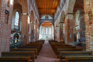 Fototapeta premium Nave of St. John's Church in Tartu, Estonia - Brick gothic lutheran church dedicated to John the Baptist