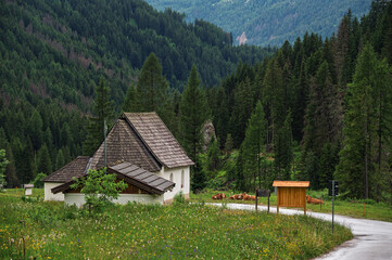 the little church of the Crucifix at the entrance of the San Nicolò valley, Pozza di Fassa, Val di Fassa, Dolomites, Italy
