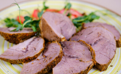 sliced roast beef, black background, copy space. High quality photo
