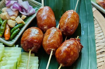 Isan sausage on a bamboo plate in an Isan restaurant