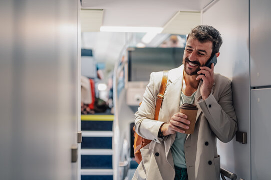 Man happily making phone call while traveling