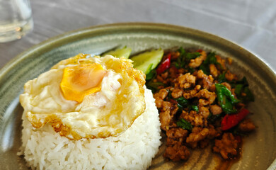Stir-fried rice with basil, minced pork and fried egg