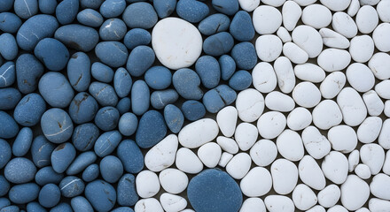Arrangement of blue and white stones with a clear separation line creating a textured and minimalist composition