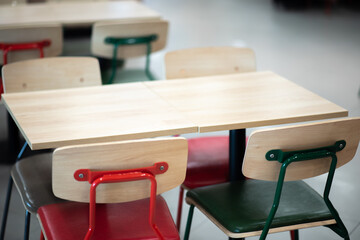 Red wooden table and metal chairs, space for displaying merchandise, images for various uses such as advertising, banners, Copy space.