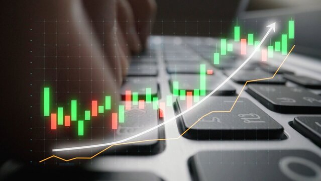 Close-up of hands typing on a laptop keyboard while analyzing stock market data displayed as colorful graphs and indicators, representing financial trading insights. Copula
