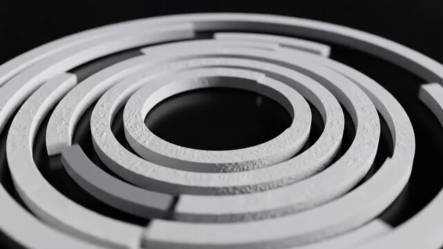 Concentric Rings of White Material on Black Background.