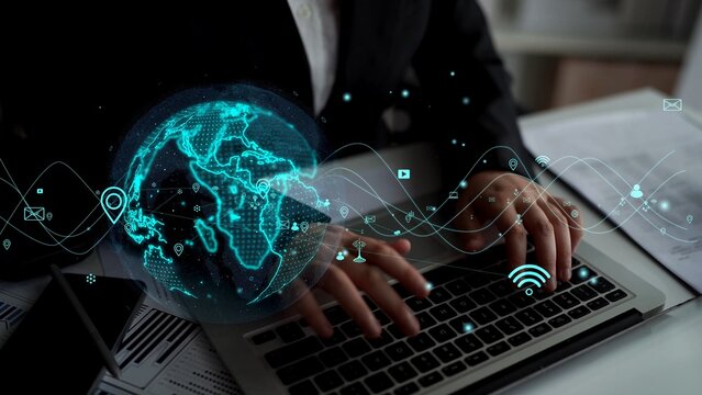 A businessman engages with a laptop, surrounded by a vivid globe and digital icons, symbolizing advanced technology and global connectivity in a modern workspace. Xenic - Powered by Adobe
