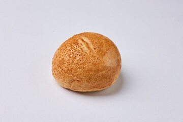 Fresh baked bread roll on white background