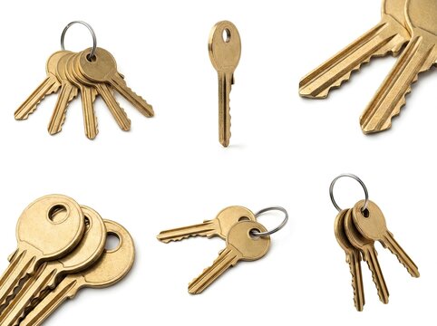 A collection of shiny brass keys on a white background - Powered by Adobe