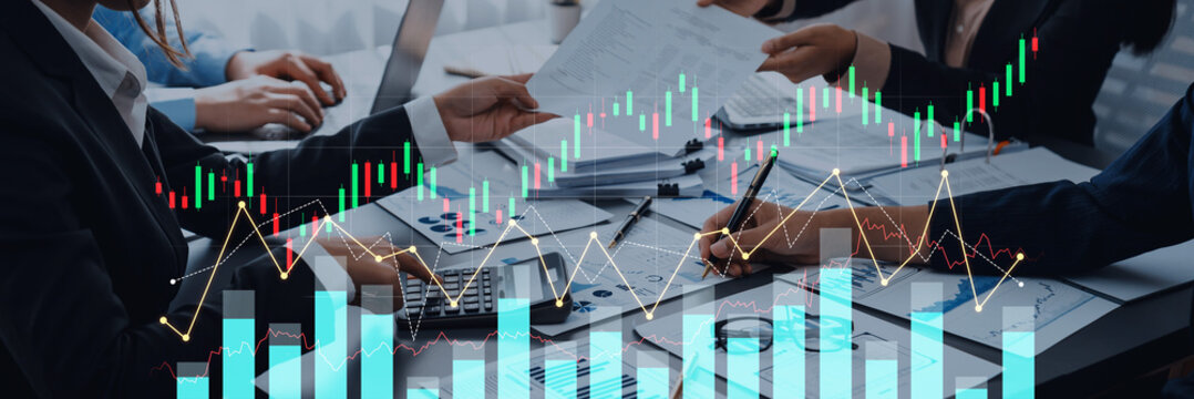 A business team collaborates in a modern office, analyzing financial data with charts and calculators, aiming for effective investment strategies and market insights. Scalp