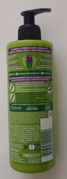 November 23 2025: Norwich, England, UK: Garnier Fructis nutri rizos curl cream bottle close-up