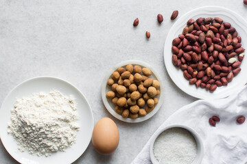 overhead view of mise en place of ingredients for making coated peanuts, process of making nigerian coated peanuts or cracker nut
