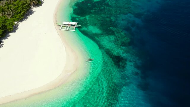 White sand beach and blue sea. view from above. Mahaba Island, Philippines. Summer and travel vacation concept.