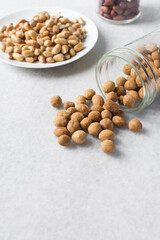 Coated peanuts or cracker peanuts on a white granite countertop