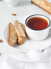 almond biscotti on a white plate, almond cantucci cookies on a white plate