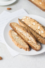 almond biscotti on a white plate, almond cantucci cookies on a white plate