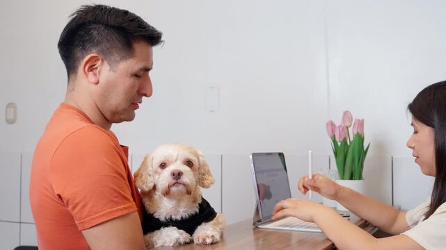 Dog owner registering pet at veterinary clinic reception desk