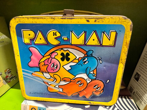 Apache Junction, Arizona - October 23, 2025: Vintage Pac-Man tin metal lunchbox from the early 1980s