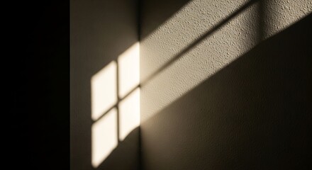 Illuminating corner light play from window creates geometric shadow patterns on textured wall with captivating contrast