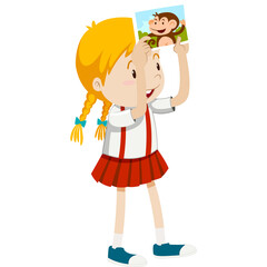 Young Girl With Blonde Pigtails And Red Skirt Holds Up A Picture Of A Monkey Smiling Wearing A White Shirt And Blue Shoes Isolated On White