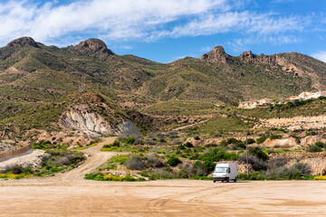 Motorhome traveling through a rural Gredas de Bolnuevo landscape