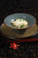 Yosenabe is a stew of meats, seafood, and vegetables. It includes fish, chicken thighs, squid, shrimp, harusame noodles, kamaboko noodles, and tofu, among other ingredients.