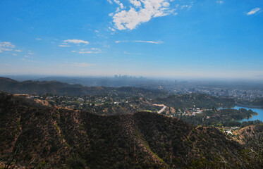 Skyline of Los Angeles as seen from the Wonder View Trailhead to Wisdom Tree on Cahuenga Peak during a summer season in Los Angeles, California, USA