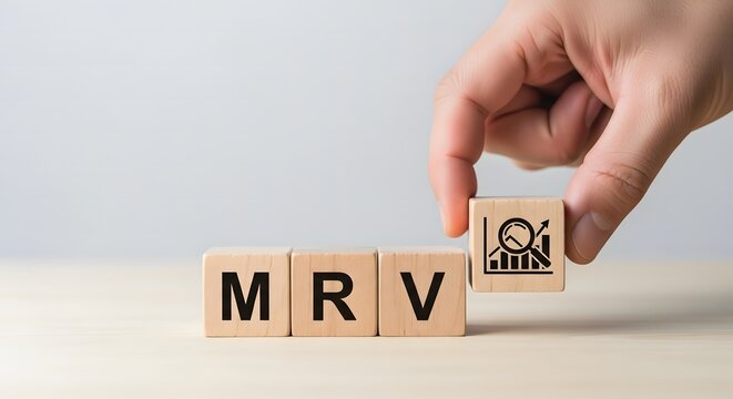 Hand placing a wooden block with a graph icon next to blocks spelling mrv, symbolizing measurement, reporting, and verification in business or environmental context
