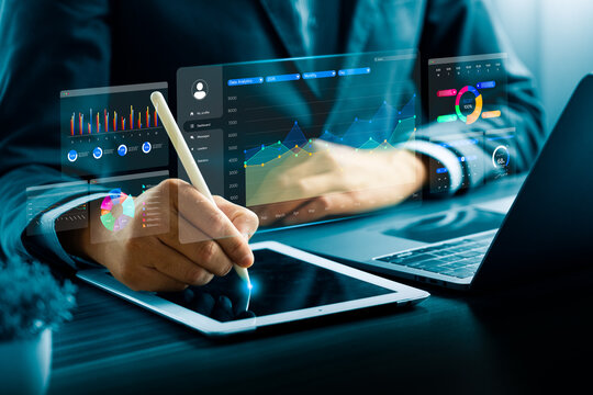 Business professional using digital tablet with stylus and data analytics dashboard, showing charts and graphs, representing financial analysis, business intelligence, big data, digital technology