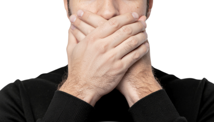 Person's Hands Covering Mouth Symbol of Silence, Secrecy, and Forbidden Speech