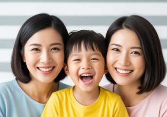 Joyful asian family portrait of two women and a laughing child