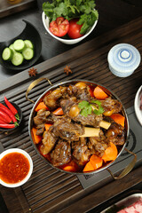 Asian Braised Lamb Stew with Bones and Vegetables in Copper Pot Traditional Dish