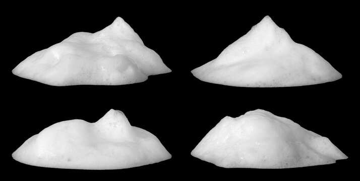 High-resolution white soap foam collection on black background, featuring four soft organic shapes with fine bubbles and smooth texture, perfect for cleaning themes, hygiene visuals, cosmetic ads