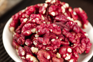 Red Coated Xinjiang Walnuts in Bowl - Premium Quality Tree Nuts with Crimson Coating