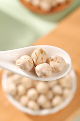 Xinjiang Five Spice Fried Chickpeas on Ceramic Spoon - Traditional Chinese Snack