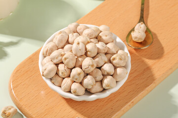 Crispy Fried Salt Chickpeas Xinjiang Style Snack in White Bowl on Wood Board