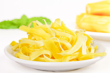 Fresh Dried Pineapple Slices from Thailand with Honey on White Plate - Tropical Fruit Snack