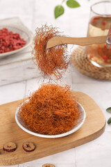 Dried Cornhusk Silk Tea Preparation with Wooden Spoon and Herbal Brewing Setup for Natural Health Benefits