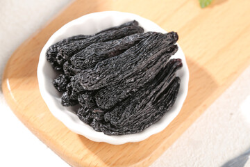 Xinjiang Black Raisins in White Bowl - Premium Dried Fruit from China