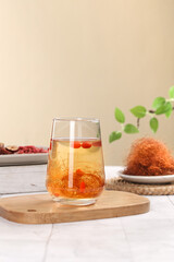 Corn Silk Tea with Berries - Traditional Herbal Health Drink on Wooden Serving Board