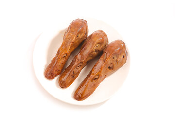 Marinated Spicy Duck Heads Traditional Asian Cuisine Delicacy on White Plate