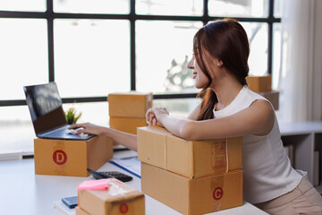 Portrait of Starting small businesses SME owners female entrepreneurs working on receipt box and...