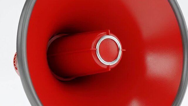 A striking close-up shot focuses on the interior of a vibrant red megaphone or loudspeaker horn, set against a clean white background. The bold red plastic surface, detailed with a metallic silver rin